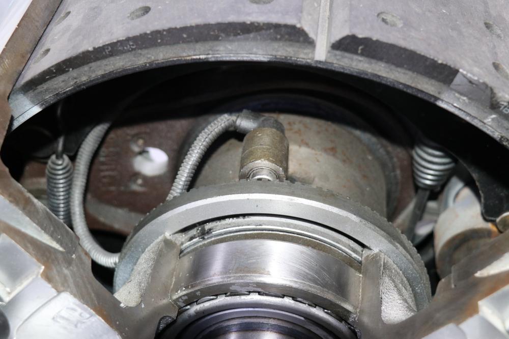 What is the function of the trailer axle?